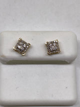 Genuine 10kt Gold & 0.25 CTW Diamond Earrings.